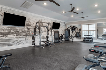 A spacious home gym with a variety of exercise equipment